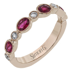 This lovely 18k rose gold band is perfect for stacking but can also stand on its own. Beautiful rubies are paired with .16 ctw of diamonds.