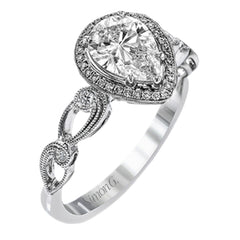 Reflecting a lovely romantic design, this white gold classic engagement ring features .16 ctw round cut white diamond accents.