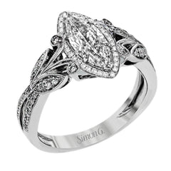 This amazing 18k white gold engagement ring features vintage-inspired design elements set with .28 ctw of white diamonds.