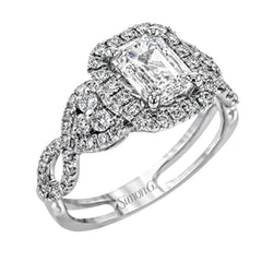 Reflecting an intricate modern design, this remarkable white gold ring is emphasized by a lovely halo complemented with .59 ctw round cut white diamonds.