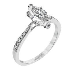 The delicate, understated design of this lovely white gold ring is elevated by .27 ctw of round white diamond accents.