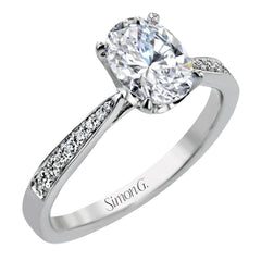 The delicate, understated design of this lovely white gold ring is elevated by .27 ctw of round white diamond accents.