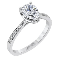 The delicate, understated design of this lovely white gold ring is elevated by .27 ctw of round white diamond accents.