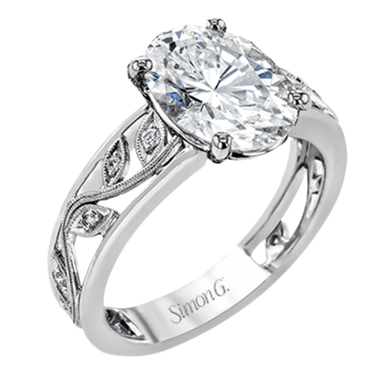 A delicate floral design highlights this vintage style engagement ring accented by .09 ctw of shimmering round cut white diamonds.