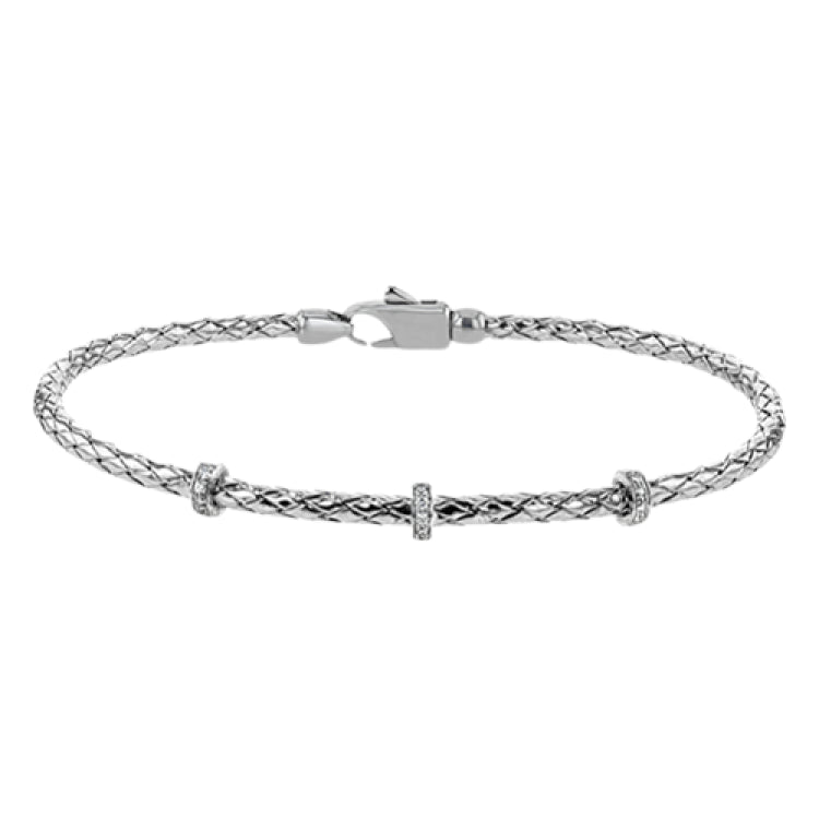 This easy-to-wear bracelet features three white gold stations set with .10ctw of diamonds set in a woven braid of 18k white gold.