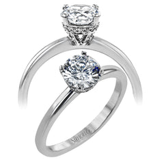 18K white gold solitare featuring .07cttw diamond underhalo.  (center stone sold separtately)