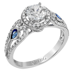 This intricate vintage-inspired engagement ring has two accent sapphire side stone totaling .25 ctw, while .33 ctw of white diamonds sparkle on the rest of the setting.