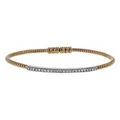 This 18k white and rose gold bangle is incredibly easy to wear, while providing a complete dose of style with .24 ctw of white diamonds. Perfect for stacking.