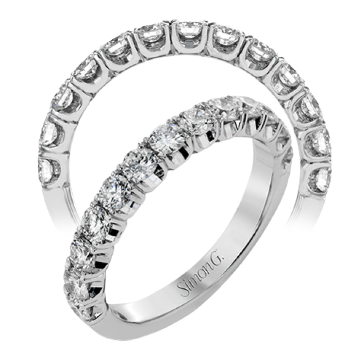 This classic wedding band contains a stunning 1.00 ctw of white round diamonds
