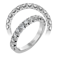 This classic wedding band contains a stunning 1.00 ctw of white round diamonds