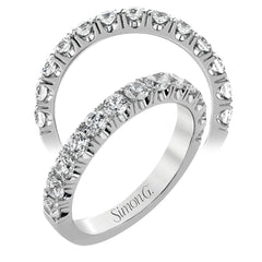 This classic wedding band features a distinctive setting style that shows off the 1.00 ctw of white diamonds to their full advantage.