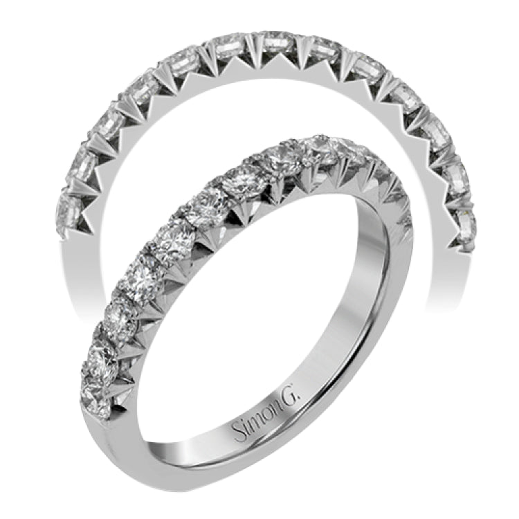 This band pairs perfectly with an engagement ring, or can be worn on its own or stacked with other rings. It contains .75 ctw of white diamonds.