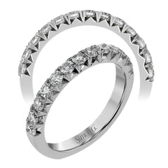 This band pairs perfectly with an engagement ring, or can be worn on its own or stacked with other rings. It contains .75 ctw of white diamonds.