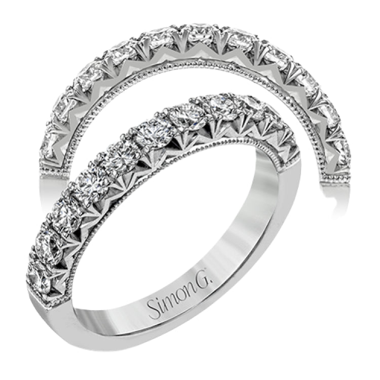 This classic wedding band features a distinctive setting style that shows off the .75 ctw of white diamonds to their full advantage.