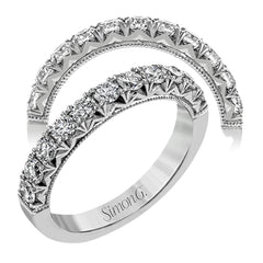 This classic wedding band features a distinctive setting style that shows off the .75 ctw of white diamonds to their full advantage.