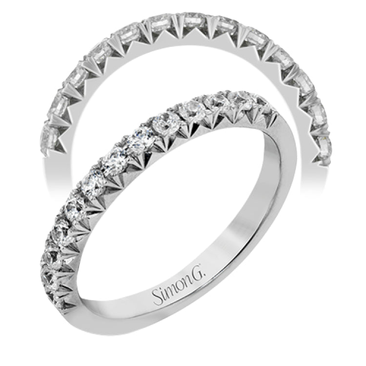 This band pairs perfectly with an engagement ring, or can be worn on its own or stacked with other rings. It contains .50 ctw of white diamonds.