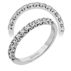 This band pairs perfectly with an engagement ring, or can be worn on its own or stacked with other rings. It contains .50 ctw of white diamonds.