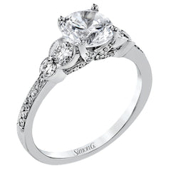 Timelessly beautiful, this white gold engagement ring's stunning design features .44 ctw of round white diamonds flanking the center stone with a lovely tapered effect.