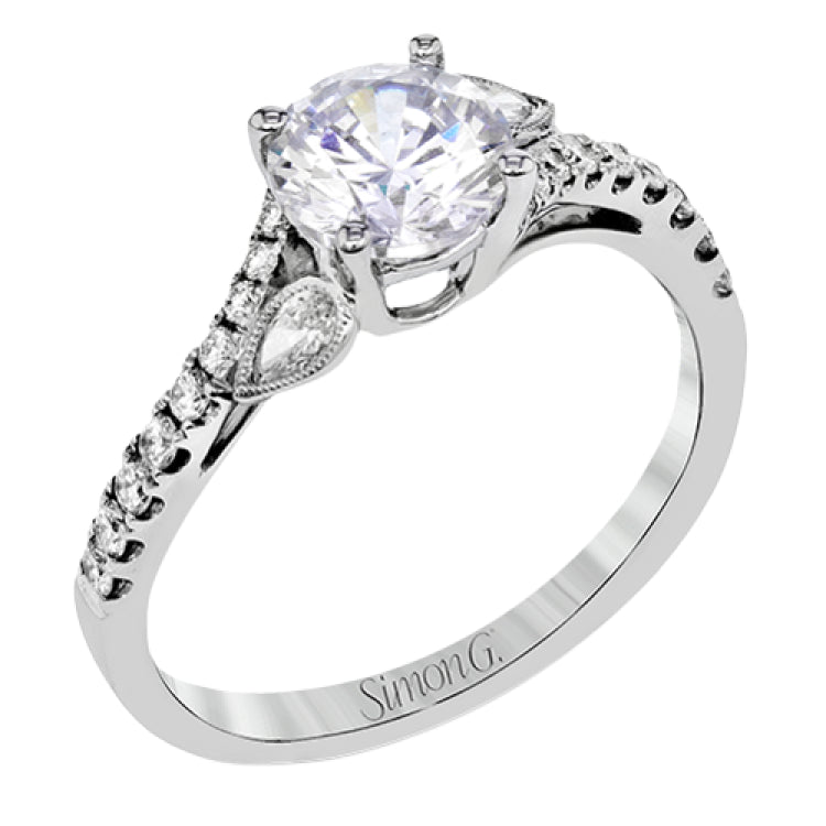 This lovely 18k white gold engagement ring contains .20 ctw of white round brilliant diamonds, highlighted by .10 pear shaped white diamonds.