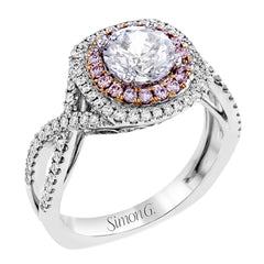 This lovely halo engagement ring is crafted in tones of 18k rose and white gold and contains .36 ctw of white diamonds along with .18 ctw of pink diamonds.
