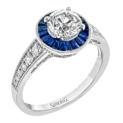 This 18k white gold engagement ring add something special with .56 ctw of baguette sapphires in a halo around the center stone. A total of .36 ctw of white diamonds finish this remarkable design.