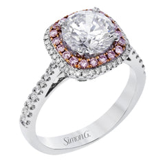 This classic style ring is formed from 18k white and rose gold. The halo design is set with .25 ctw of white diamonds as well as .18 ctw of pink diamonds.