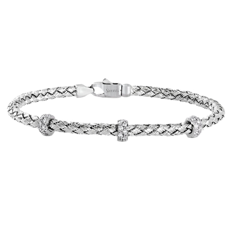This woven 18k white gold bracelet is ideal for layering, but can also stand on its own. A total of .33 ctw of white diamonds add sparkle to this piece. Perfect for stacking.