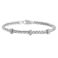 This woven 18k white gold bracelet is ideal for layering, but can also stand on its own. A total of .33 ctw of white diamonds add sparkle to this piece. Perfect for stacking.