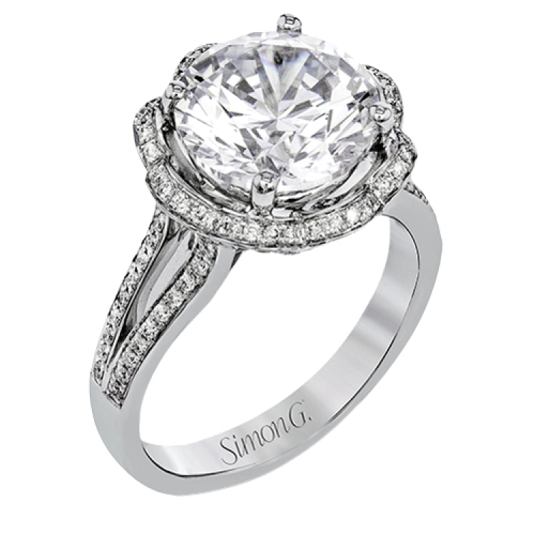 This lovely 18k white gold engagment setting features a wavy halo reminiscent of an opening flower set with .50 ctw of white diamonds.