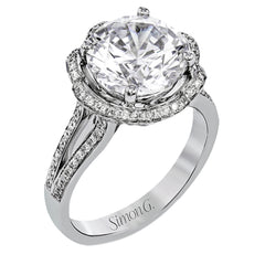 This lovely 18k white gold engagment setting features a wavy halo reminiscent of an opening flower set with .50 ctw of white diamonds.