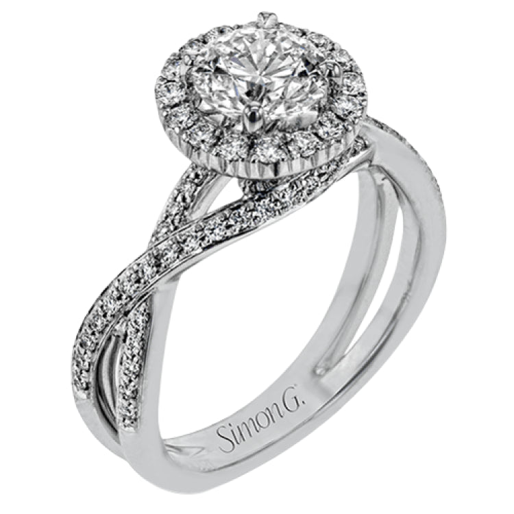 This sparkling modern engagement ring features an eye-catching twisted design with elegant classic halo accented by .29 ctw of shimmering round cut white diamonds.