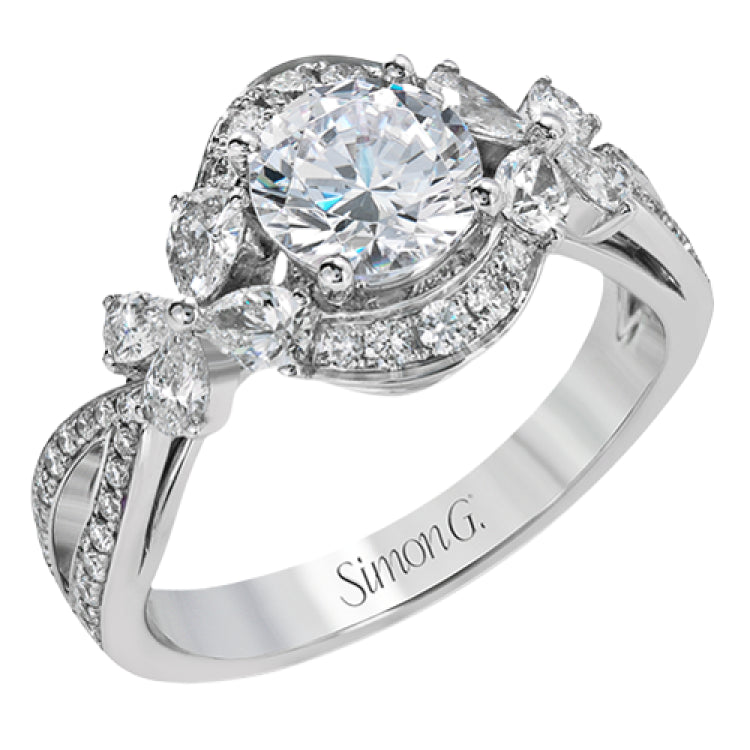 Dramatic yet romantic, this exquisite white gold engagement ring features .30 ctw of round cut white diamonds highlighted by .54 ctw of pear shaped diamonds in delicate floral motifs.