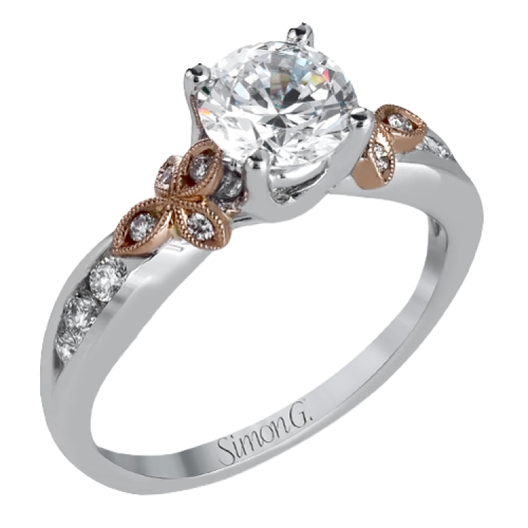 This delicate white gold ring features lovely rose gold accents on the shank and is set with .24 ctw of round cut white diamond accents.