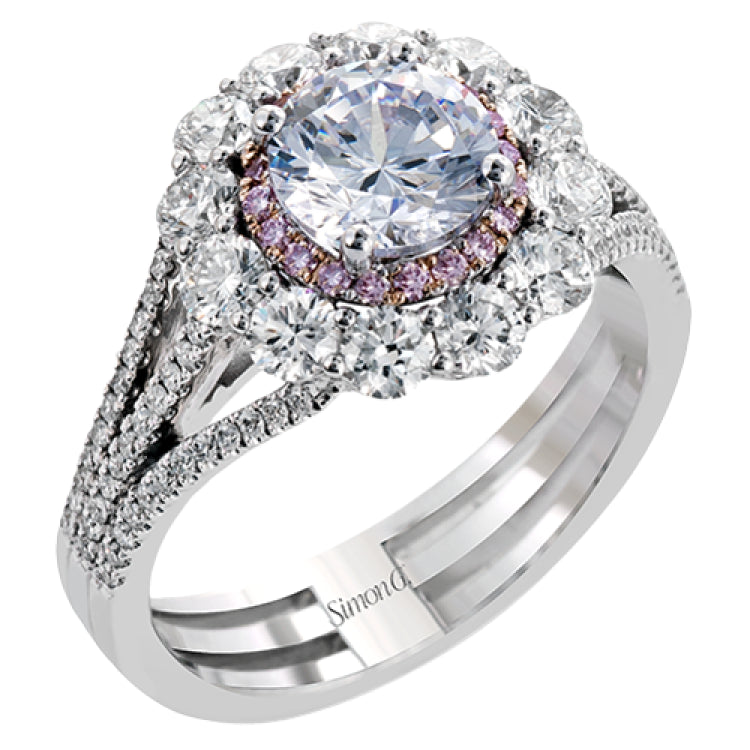 This lovely white gold contemporary ring features a dazzling halo of .10 ctw pink diamonds accented by 1.13 ctw round cut white diamonds.