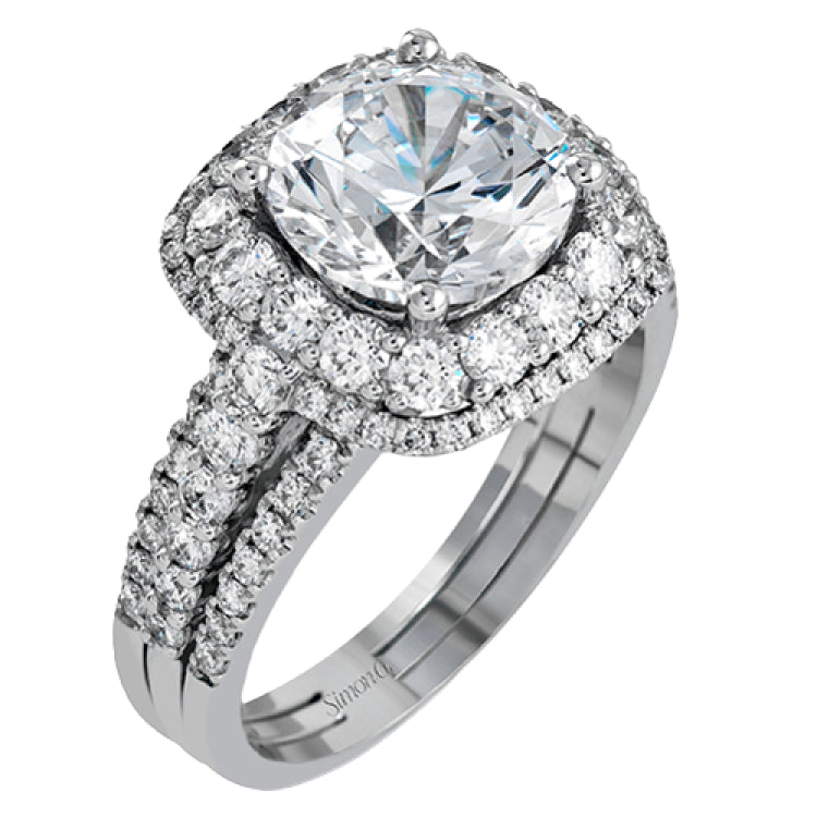 Featuring a brilliant halo setting, this contemporary white gold ring is set with 1.35 ctw glistening round cut white diamonds.