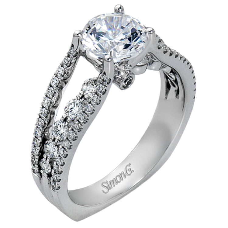 The lovely vintage style of this white gold engagement ring is further enhanced by .91 ctw of shimmering round cut diamonds.