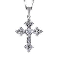 This delicately styled classic white gold cross is beautifully set with .47 ctw of glistening round cut white diamonds accents.