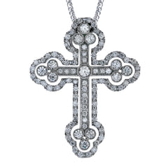 Set with a shimmering center diamond, this Gothic style cross pendant features 1.43 ctw of sparkling white diamonds through its stunning design.