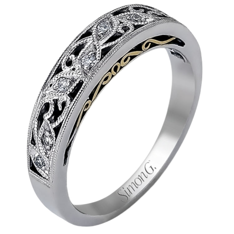Featuring a delicate, intricate vintage style, this white gold wedding band is set with .09 ctw of shimmering white diamonds.