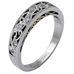Featuring a delicate, intricate vintage style, this white gold wedding band is set with .09 ctw of shimmering white diamonds.