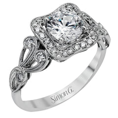 The lovely vintage design of this impressive white gold ring is emphasized by .27 ctw sparkling round cut white diamonds.