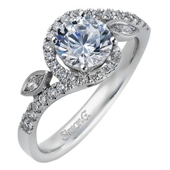 The charming floral design of this contemporary white gold ring is enhanced by .28 ctw of round cut white diamonds and .07 ctw of marquise cut white diamonds.
