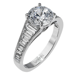 Baguette diamonds increasing in size lead the way to the center of this gorgeous engagement ring design. The outside edge is decorated with delicate milgrain, and this ring contains .98 ctw of side diamonds.