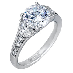 This classically designed white gold ring is emphasized by .18 ctw of white diamonds and .51 half moon shaped diamonds to create a memorable setting.