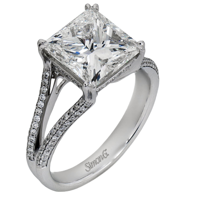 This lovely classic white gold engagement ring is accentuated by .34 ctw of round cut white diamonds in an eye-catching openwork design.