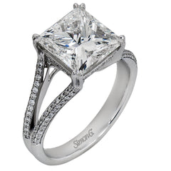 This lovely classic white gold engagement ring is accentuated by .34 ctw of round cut white diamonds in an eye-catching openwork design.