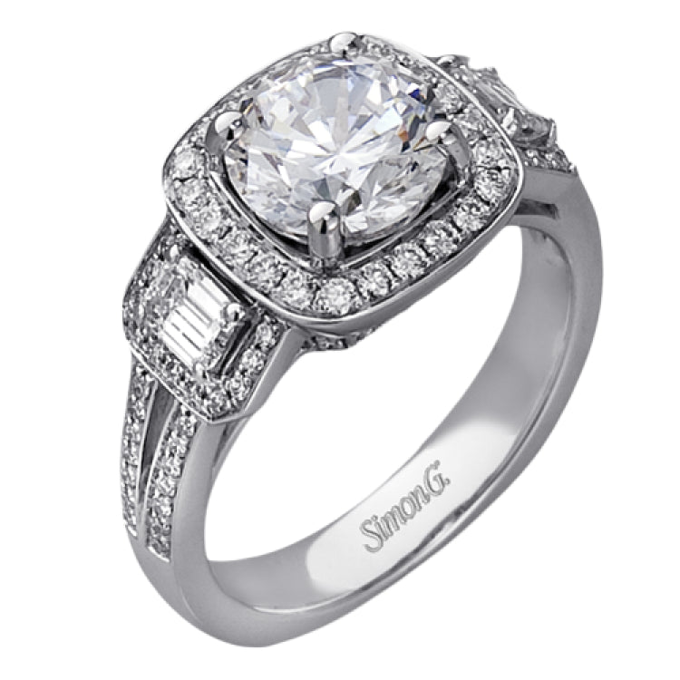 The dazzling contemporary design of this white gold engagement ring is emphasized by .44 ctw round cut white diamonds and .45 ctw emerald cut white diamonds.