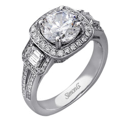 The dazzling contemporary design of this white gold engagement ring is emphasized by .44 ctw round cut white diamonds and .45 ctw emerald cut white diamonds.