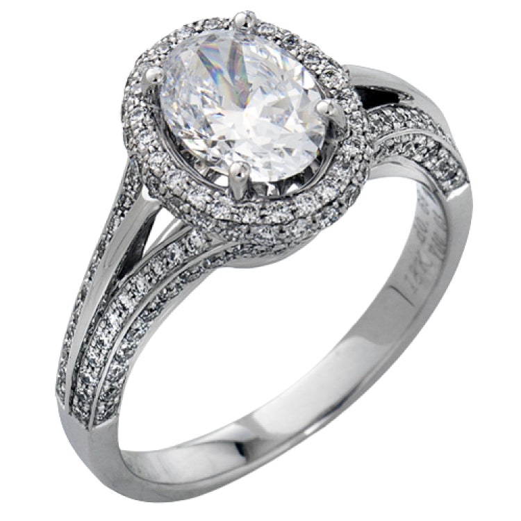This lovely 18k white gold engagement ring design is created for an elegant oval center stone and features .77 ctw of white diamonds accented by a small touch of .03 ctw of yellow diamonds.