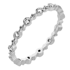 This diamond eternity band from our stackable collection in 14K yellow gold, has alternating bezel set diamonds 0.31 ctw. and gold beads.